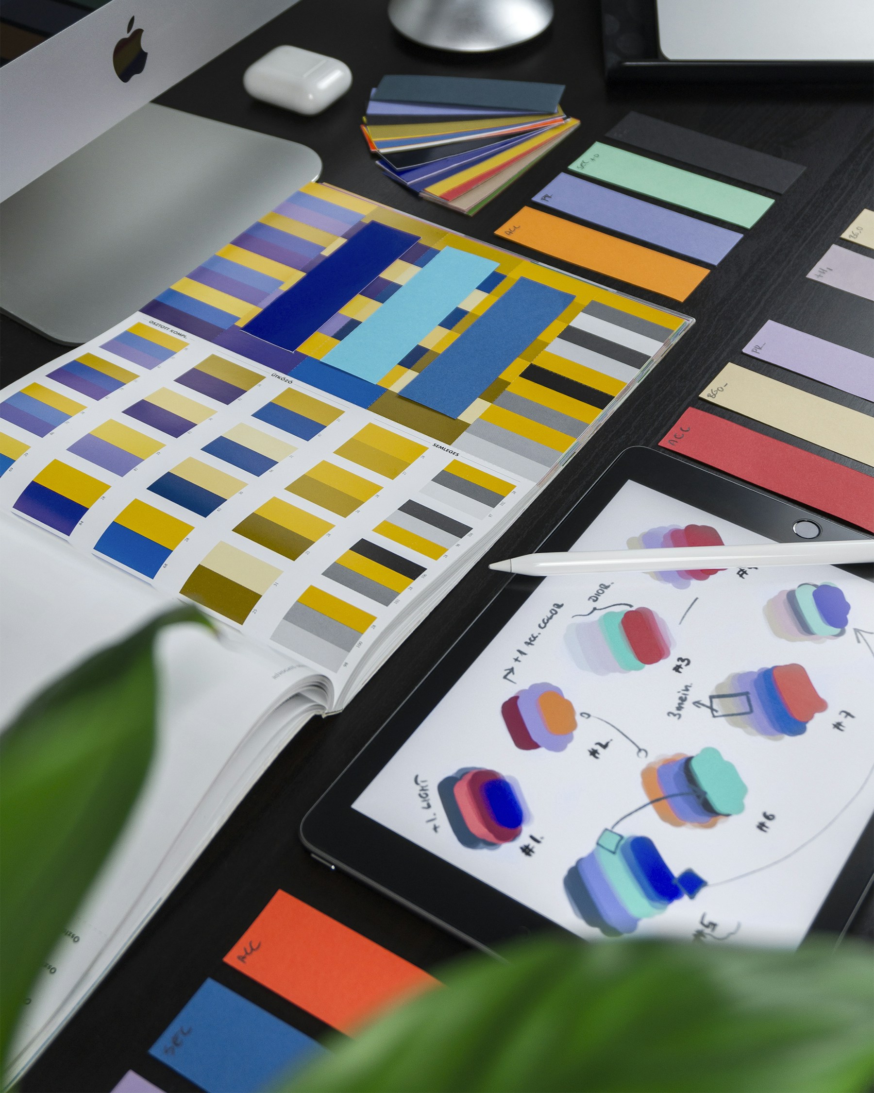 Creative archive workspace with brand reference materials on a studio shelf